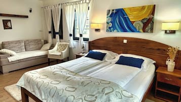 Family Room, Garden View | In-room safe, individually decorated, individually furnished, desk