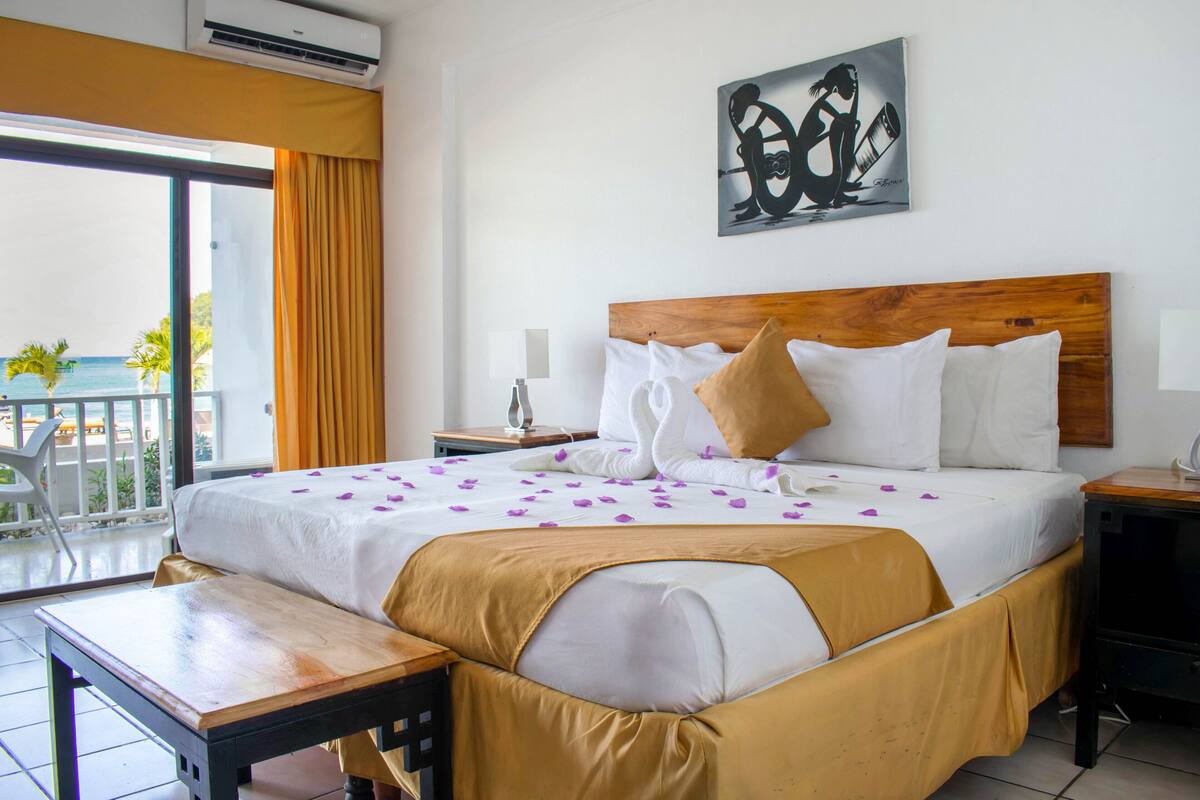 Premium Suite, 1 Bedroom, Beachfront | Minibar, in-room safe, desk, blackout curtains