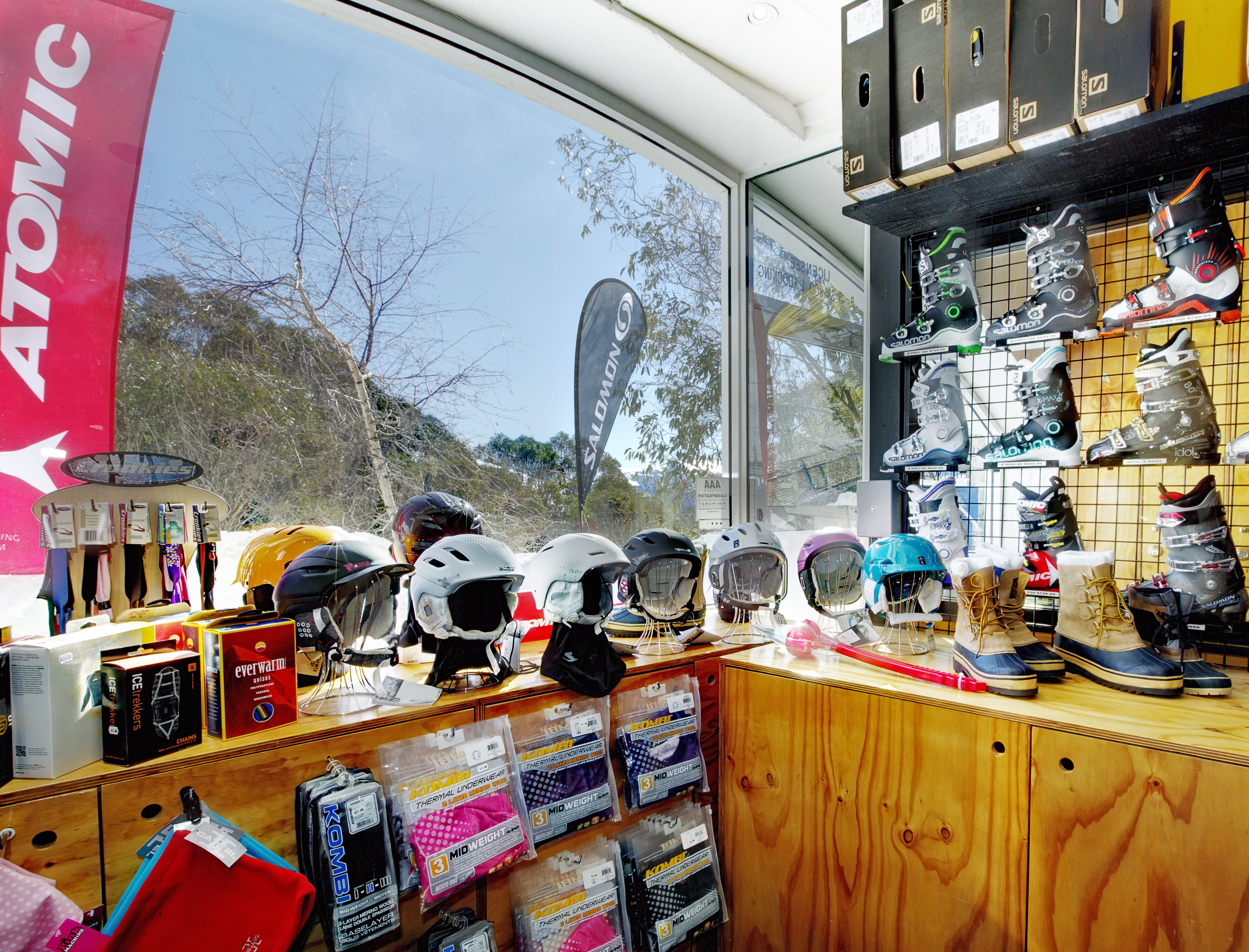 A store with various helmets and protective gear on display.