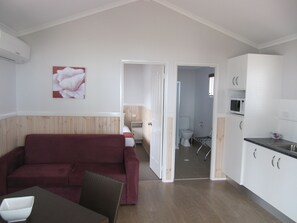 Deluxe Villa, 1 Bedroom, Ocean View (Sleeps 2 Max) | Living area | Flat-screen TV, DVD player - Tropical Beach Caravan Park (Bowen)