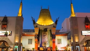 A large, ornate building with a central tower and two symmetrical wings, likely a cinema or entertainment venue. - Crenshaw Inn Motel (Los Angeles)