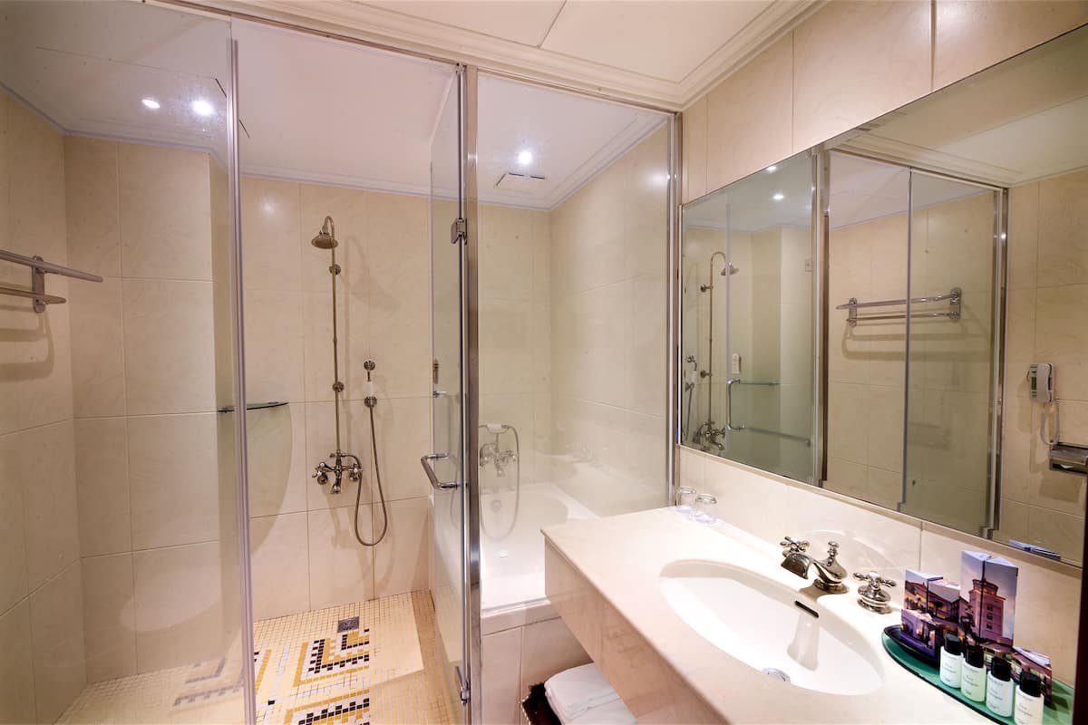 luxury double room, 1 king bed | bathroom | combined shower/bathtub, free toiletries, hair dryer, slippers