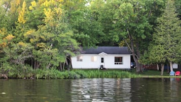 Escape to a serene lakeside retreat, surrounded by lush greenery and tranquil waters.
