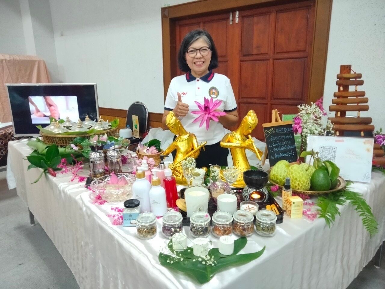 A table with various items including jars, candles, and decorative objects.