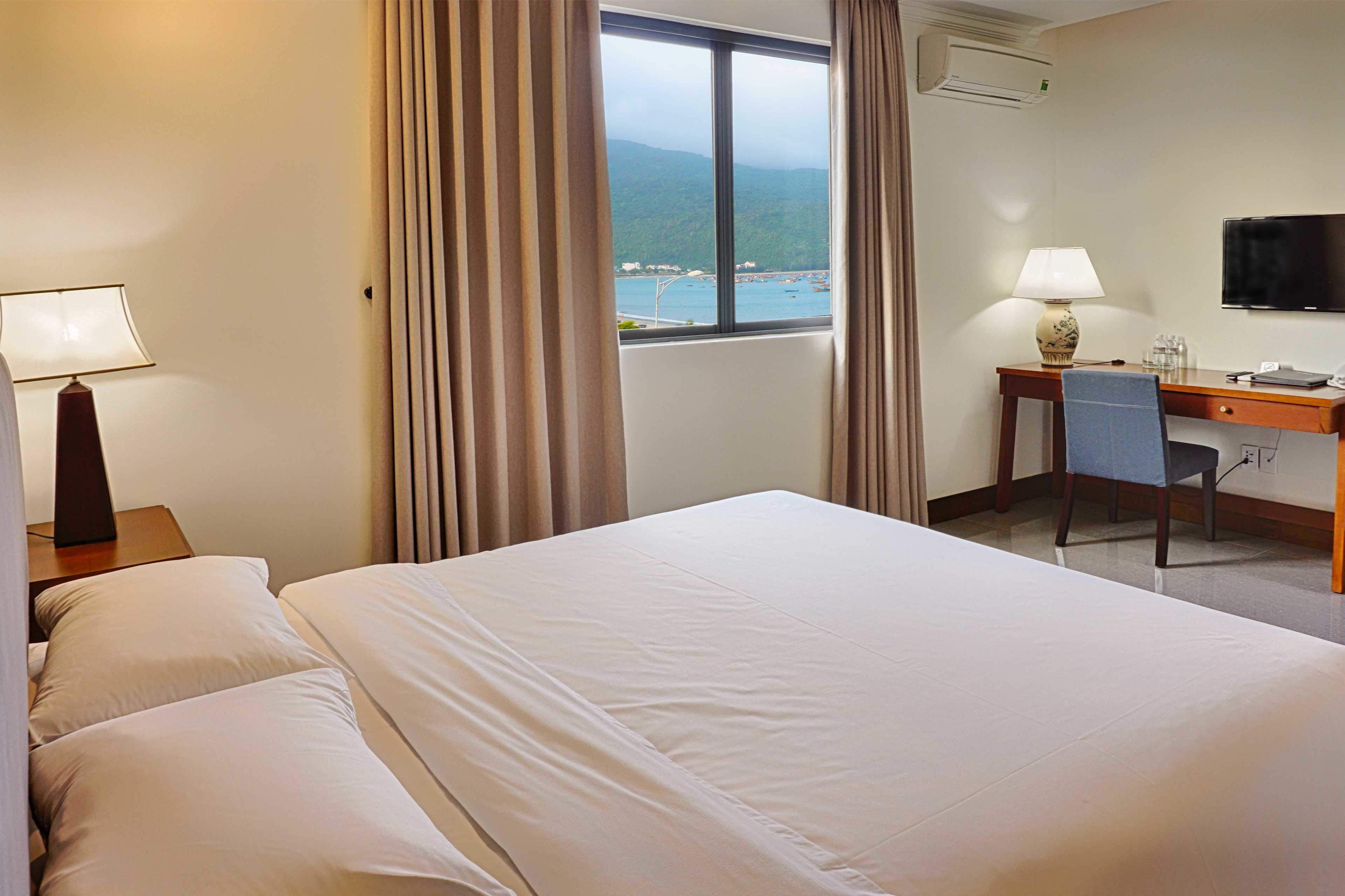 superior room, partial ocean view | minibar, in-room safe, desk, blackout curtains