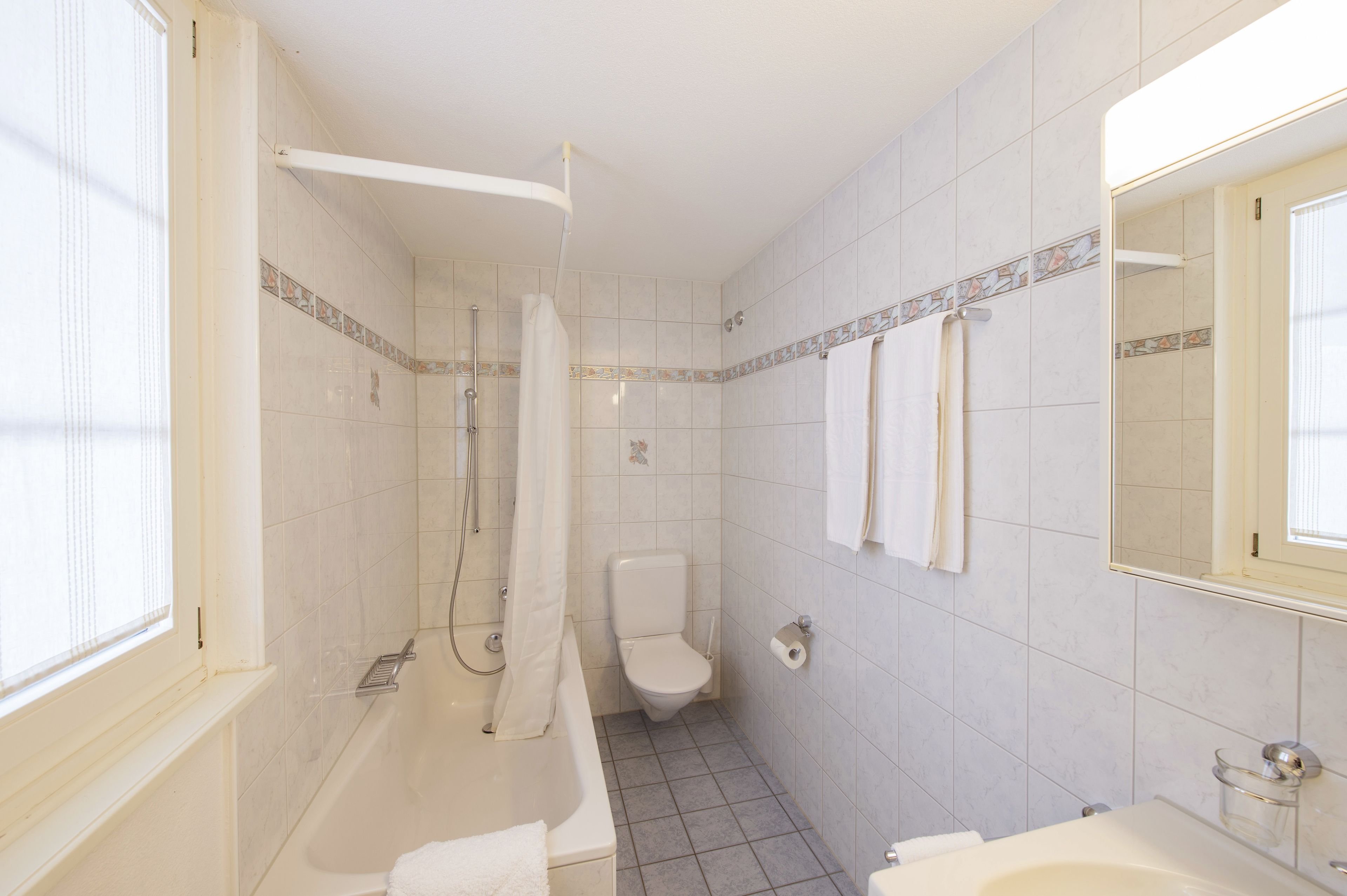 hair dryer, bathrobes, slippers, towels