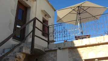 Apartment, 1 Bedroom, Balcony (Chryssi) | Living area | 19-inch TV with cable channels