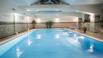 Indoor pool, open 8:00 AM to 8:00 PM, pool loungers