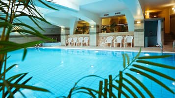 Indoor pool, open 8:00 AM to 8:00 PM, pool loungers