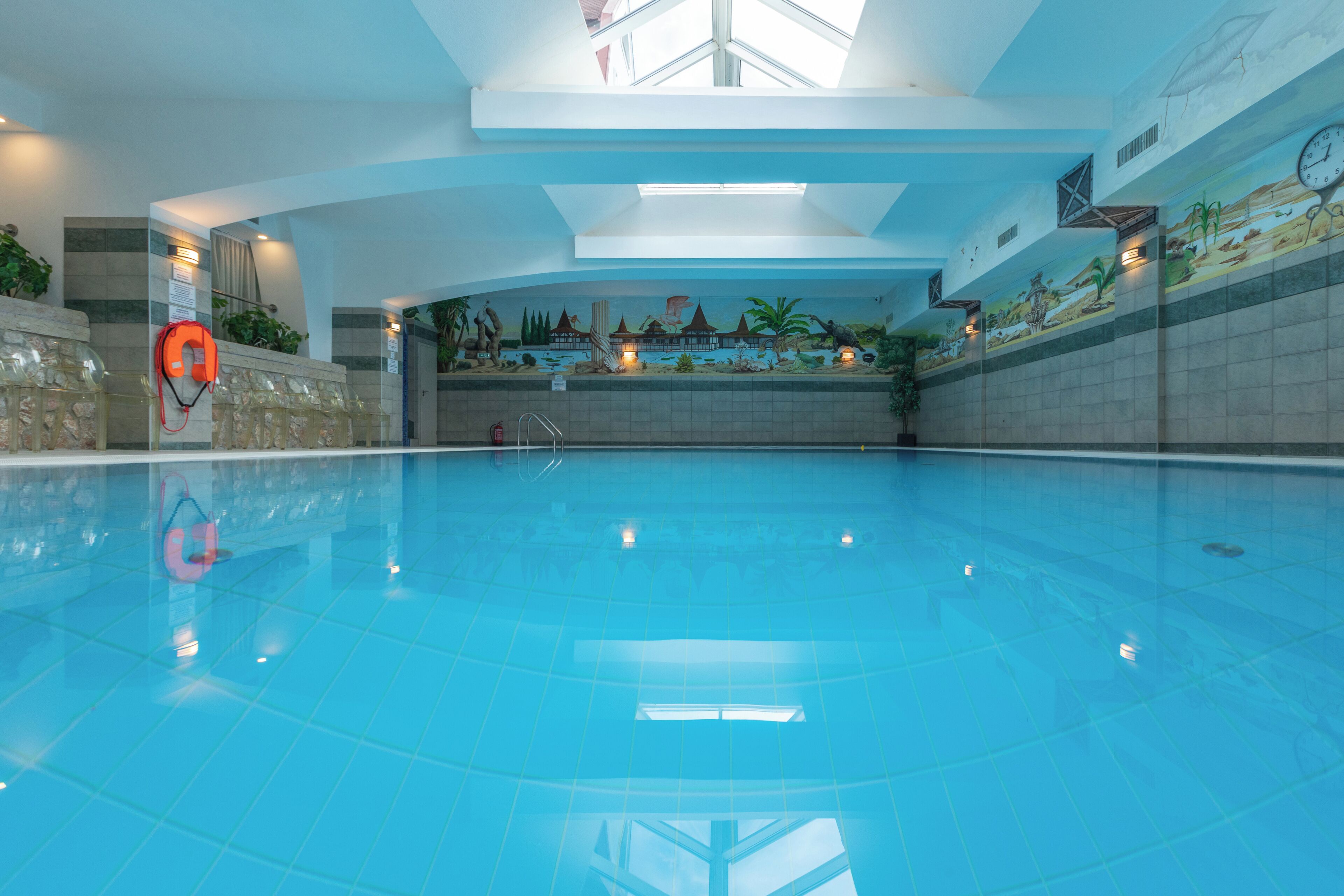 Indoor pool, open 8:00 AM to 8:00 PM, pool loungers