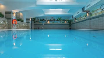 Indoor pool, open 8:00 AM to 8:00 PM, pool loungers