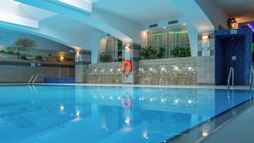 Indoor pool, open 8:00 AM to 8:00 PM, pool loungers