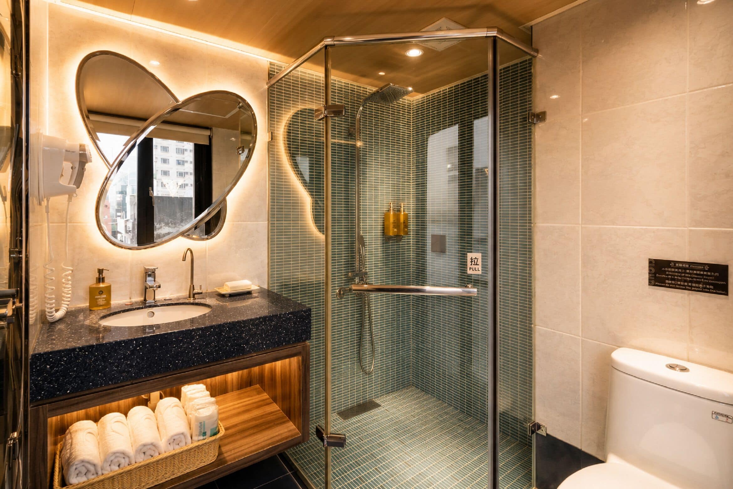 Shower, hair dryer, slippers, towels