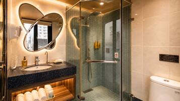 Shower, hair dryer, slippers, towels