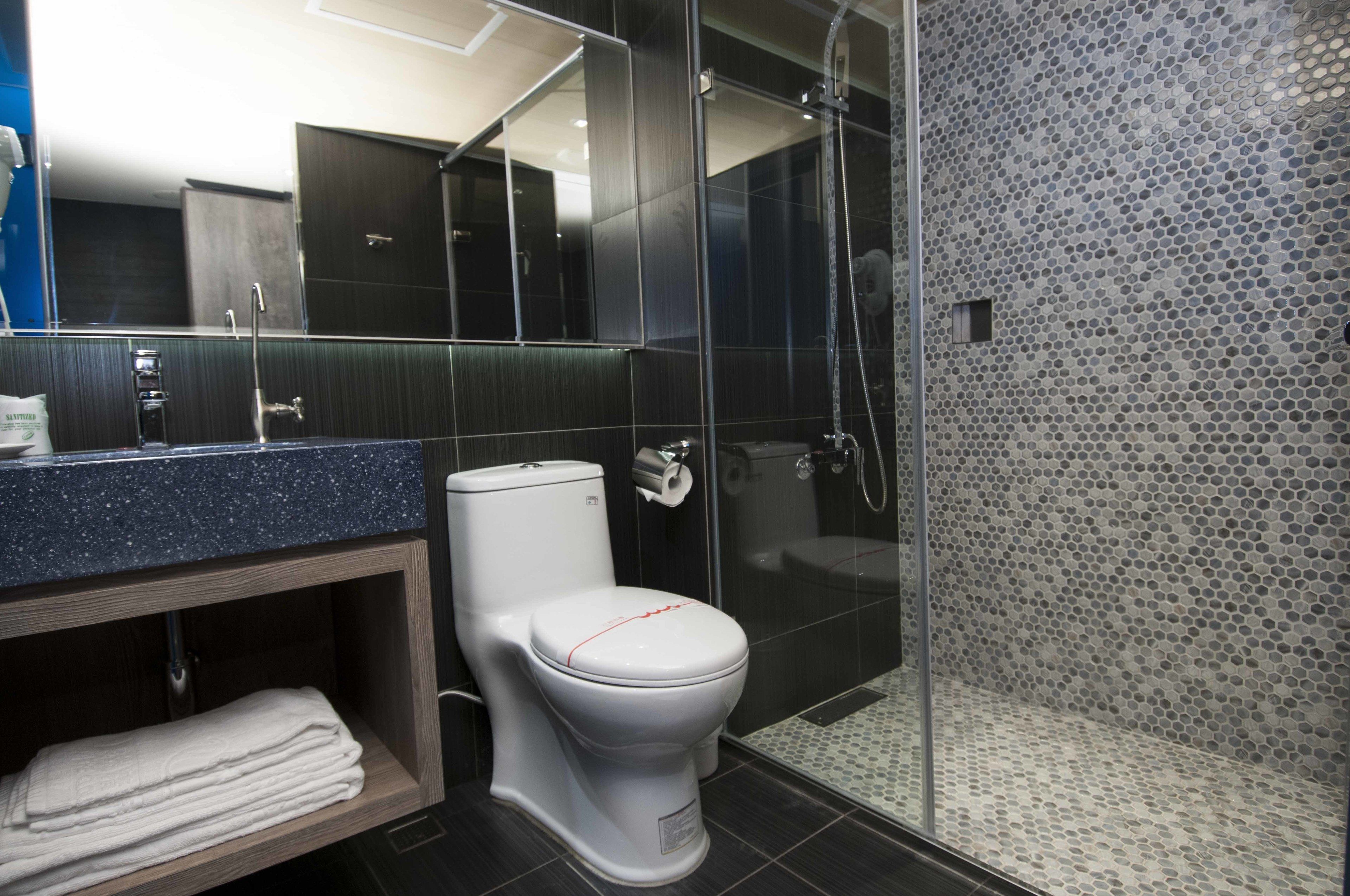 standard twin room (non-smoking) | bathroom | shower, hair dryer, slippers, towels