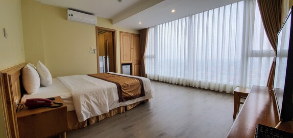 Habitación Deluxe | 1 dormitorio, minibar, escritorio y camas supletorias