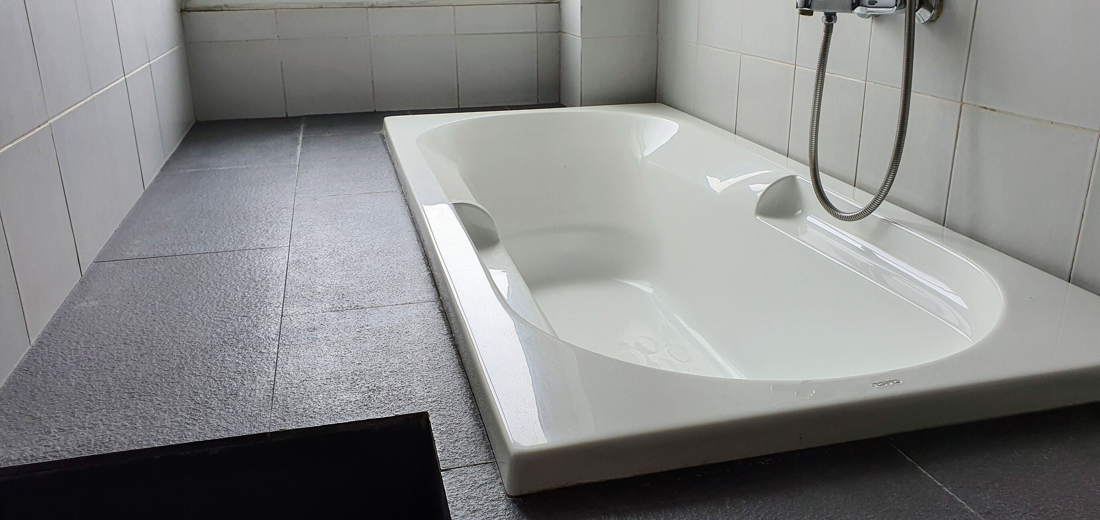 deluxe room | bathroom | shower, hair dryer, slippers, towels