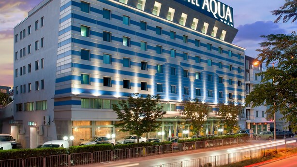 A modern hotel building with a prominent sign reading "HOTEL AQUA". - AQUA Hotel (Varna)