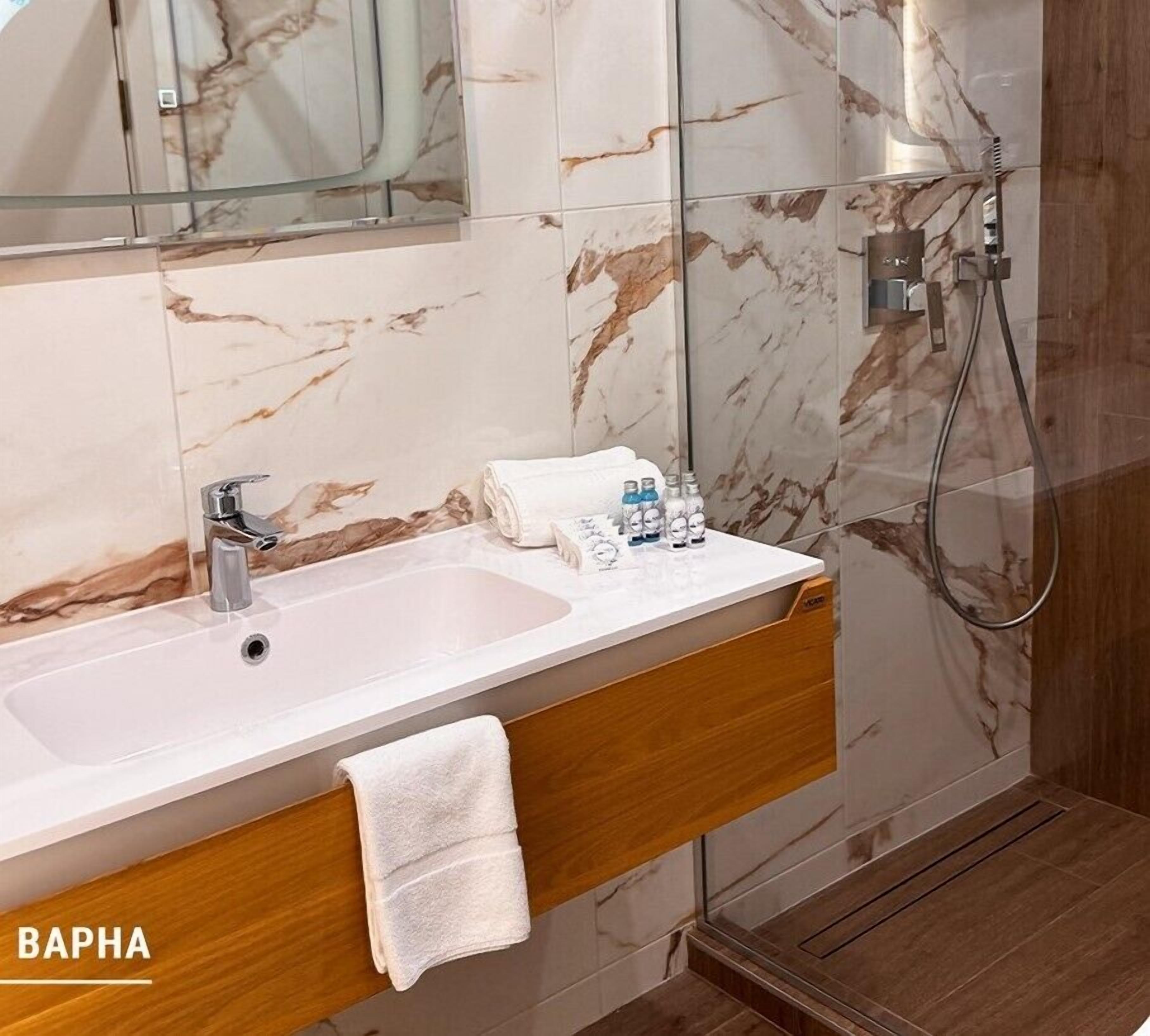 premium studio | bathroom | designer toiletries, hair dryer, towels