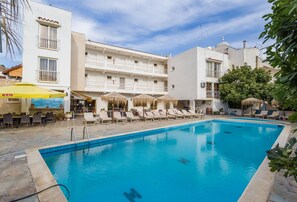 Seasonal outdoor pool, pool umbrellas, pool loungers