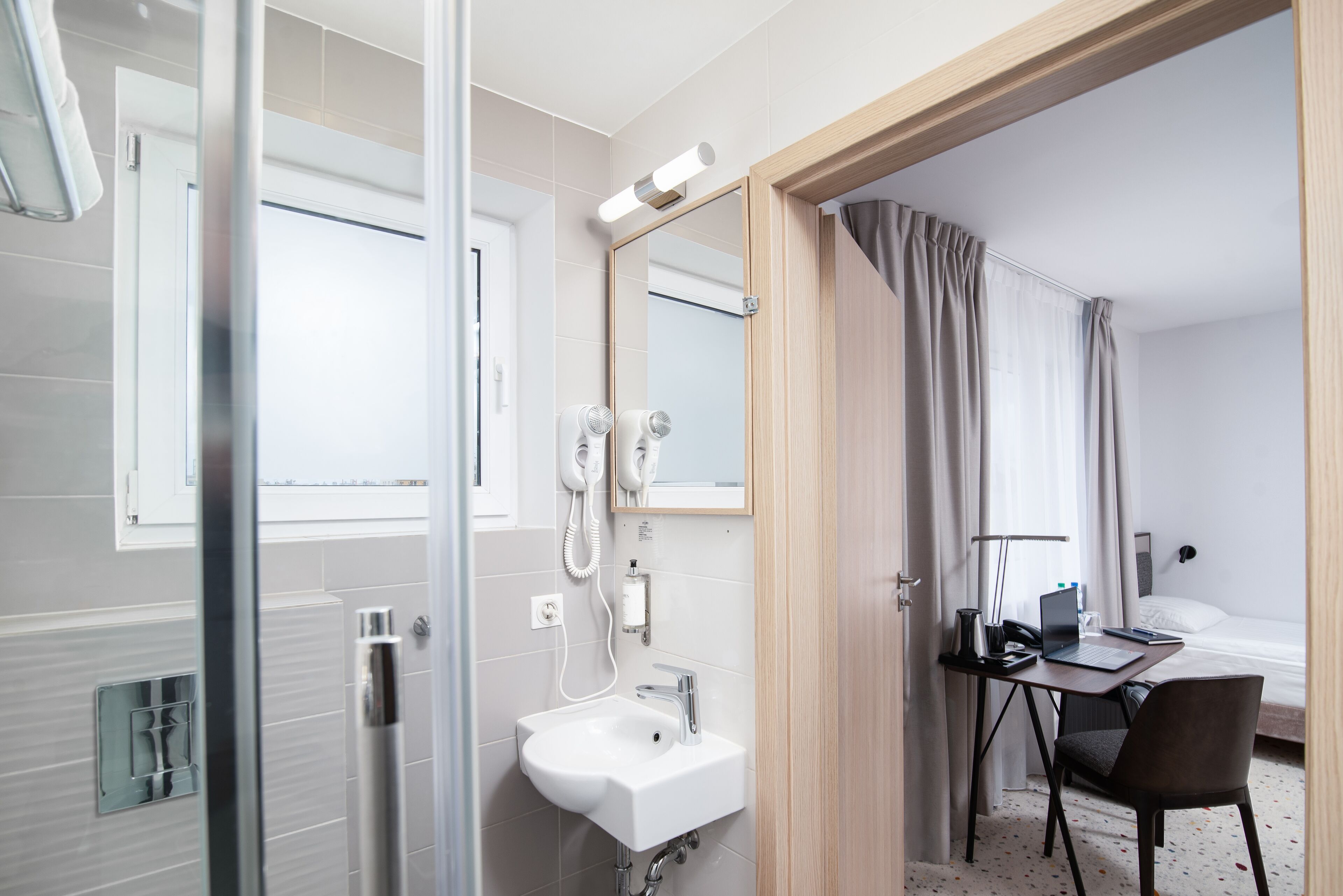 classic twin room | bathroom | shower, free toiletries, hair dryer, towels