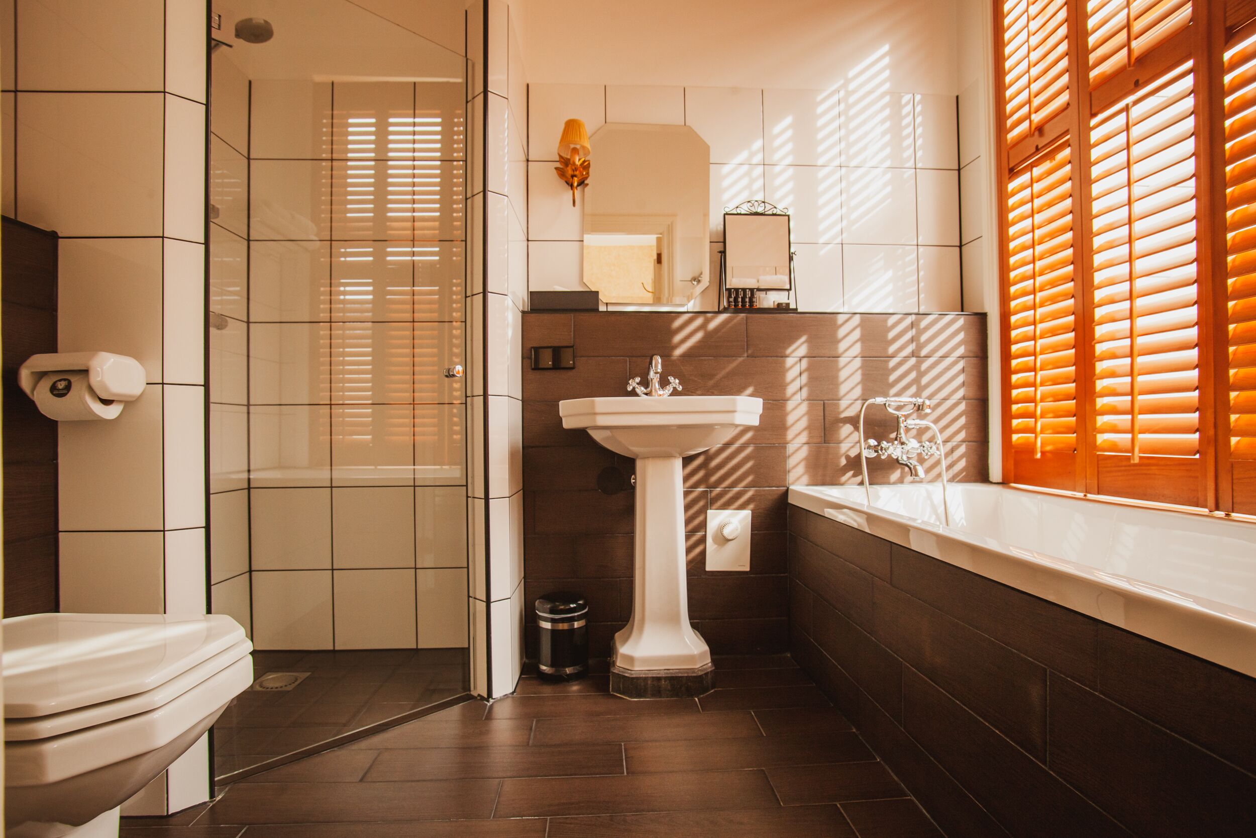 deluxe room, 1 bedroom | bathroom | designer toiletries, hair dryer, dressing gowns, slippers