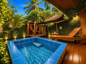 A swimming pool with a wooden deck, surrounded by lush greenery and a thatched-roof structure. - 墾丁阿飛衝浪旅店 Afei Surf Inn - 步行南灣五分鐘 5 Min Walk from South Beach (Hengchun)