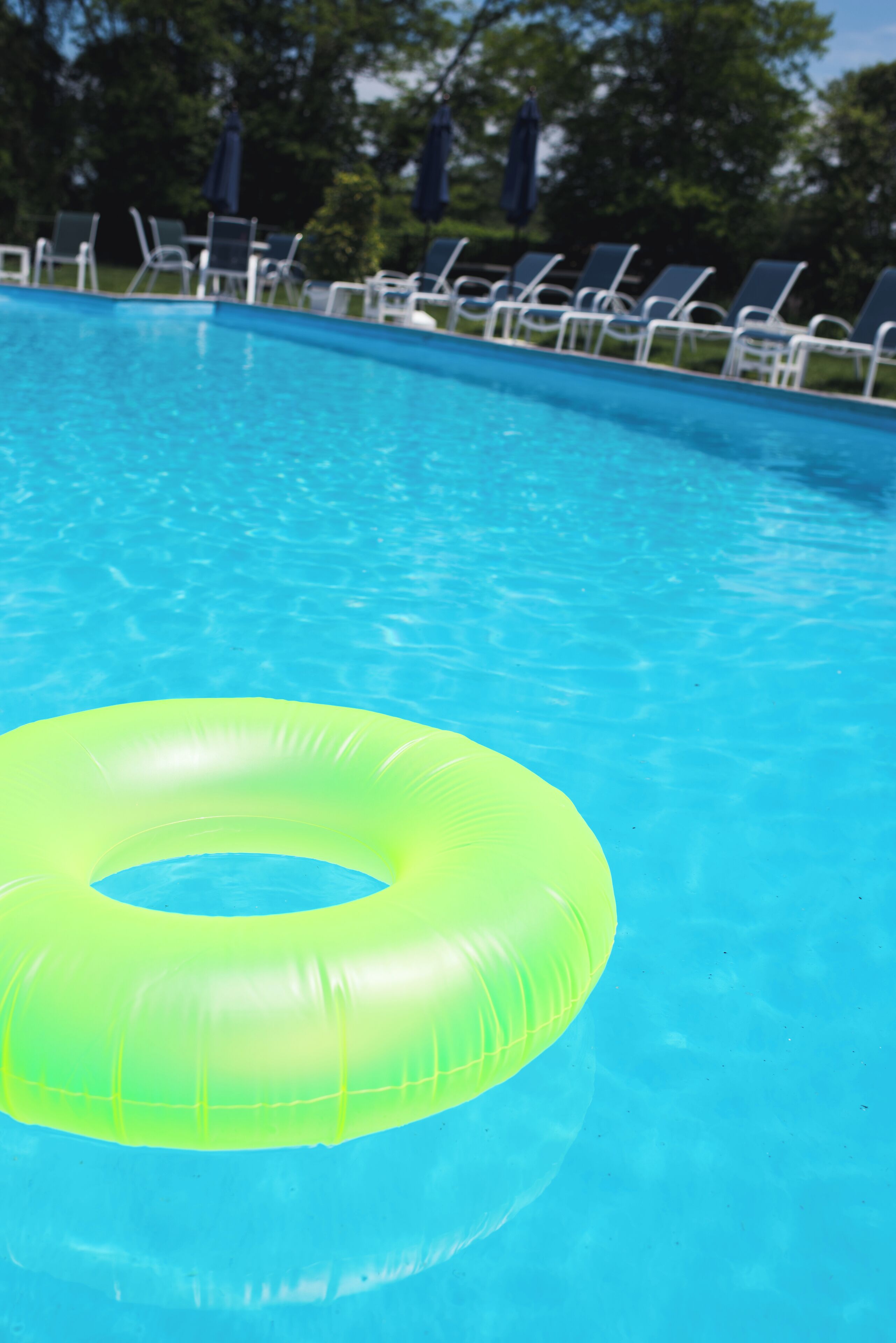 seasonal outdoor pool, open 8:00 am to 8:00 pm, pool umbrellas