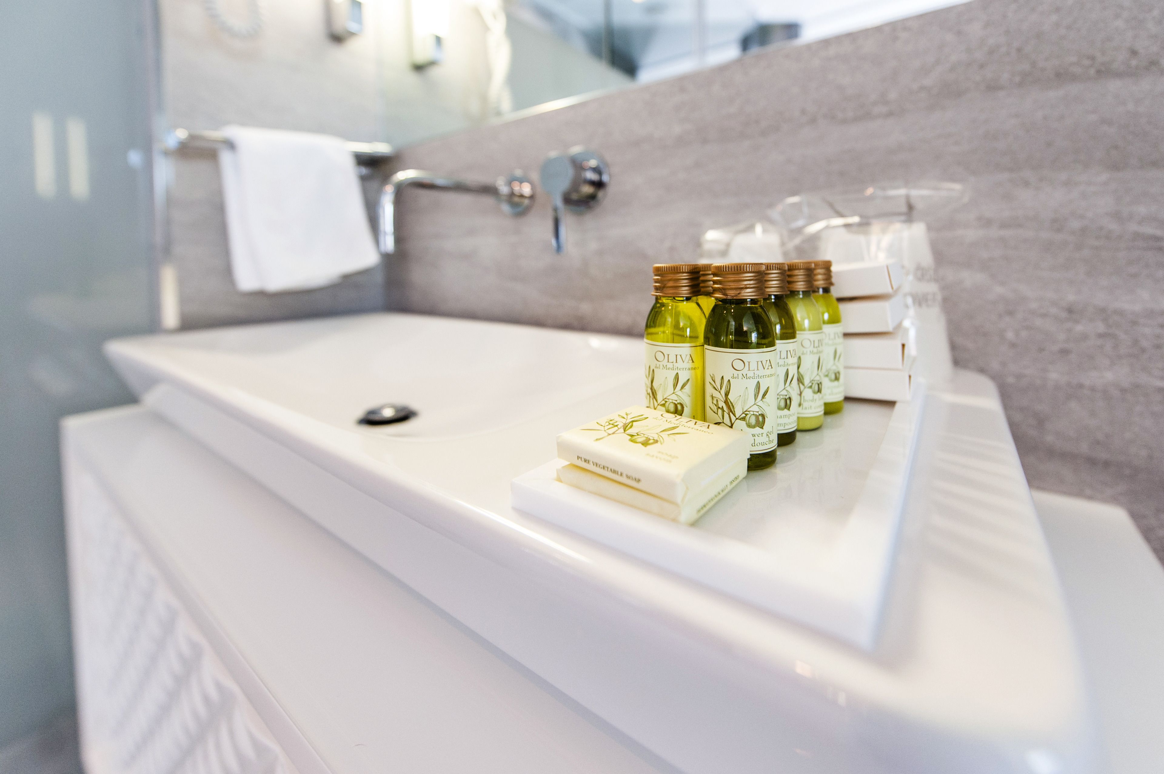 separate bathtub and shower, rainfall showerhead, designer toiletries