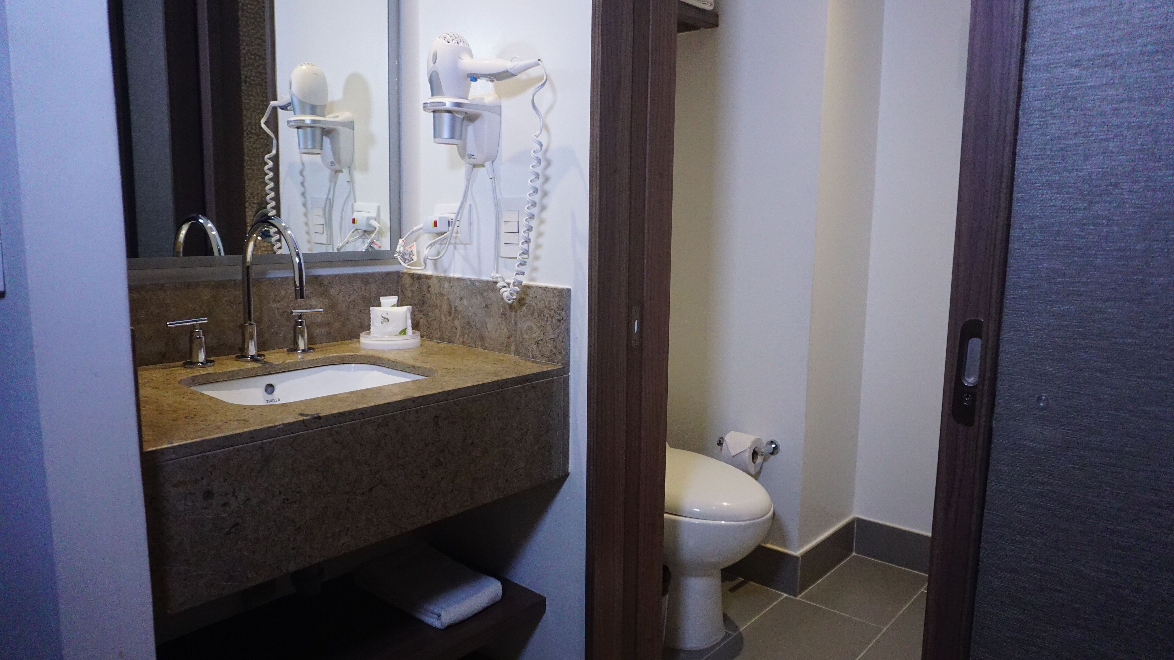 shower, designer toiletries, hair dryer, towels