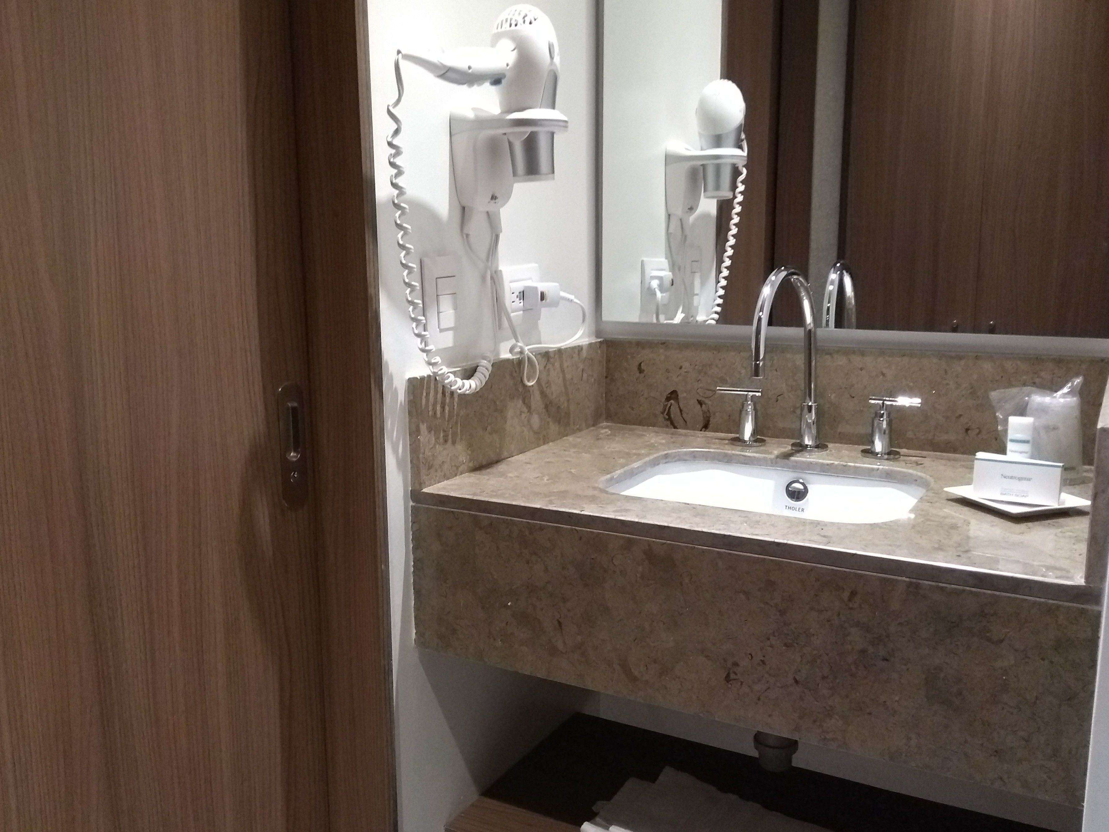 shower, designer toiletries, hair dryer, towels