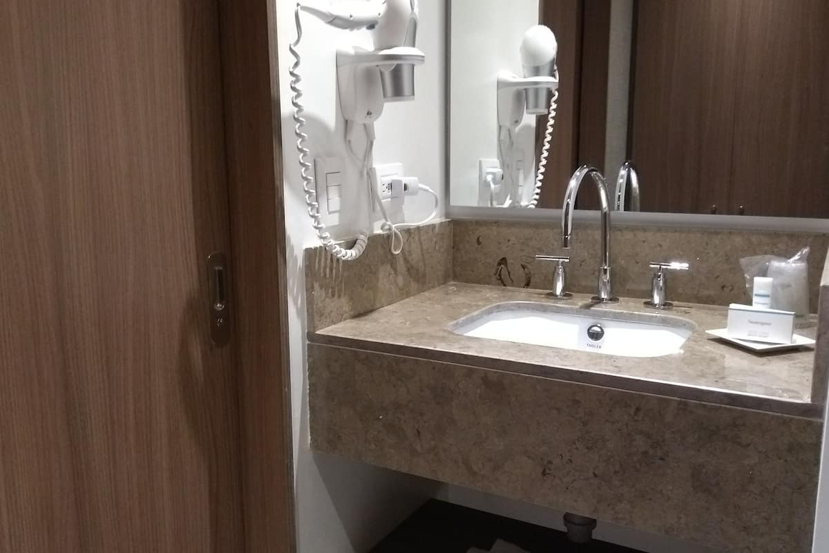 shower, designer toiletries, hair dryer, towels