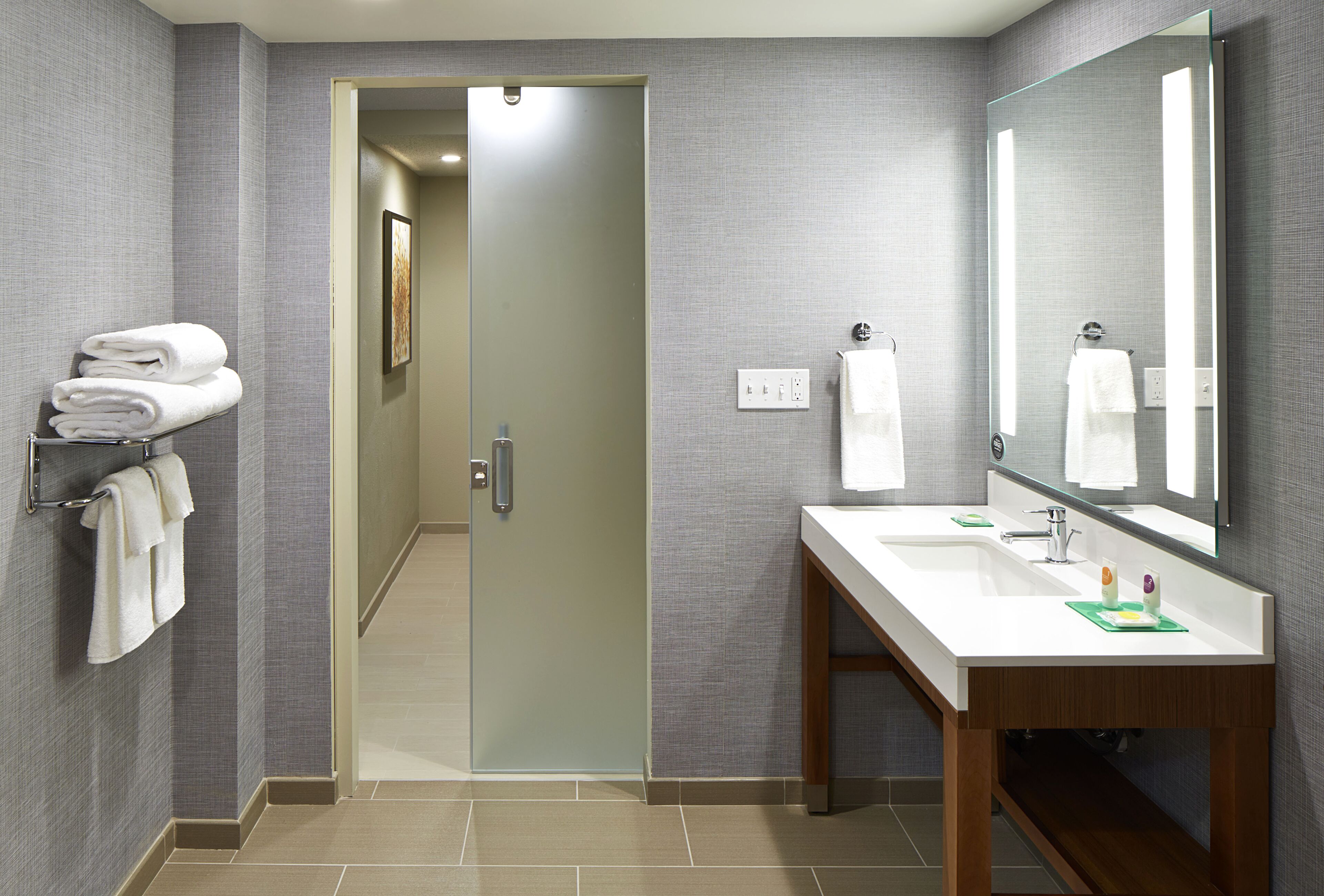 suite, 1 king bed, accessible (shower) | bathroom | designer toiletries, hair dryer, towels