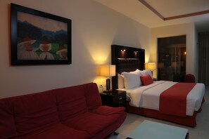 Junior Suite, 1 Bedroom | Living area | 32-inch flat-screen TV with cable channels, TV