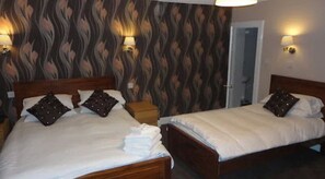 Family Triple Room | Desk, iron/ironing board, free WiFi, bed sheets