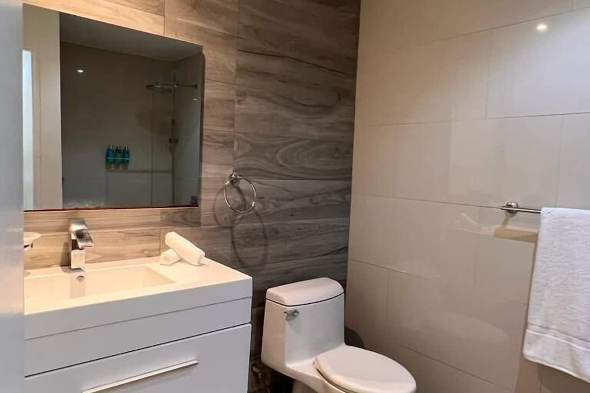 two bedroom villa | bathroom | shower, rainfall showerhead, free toiletries, hair dryer