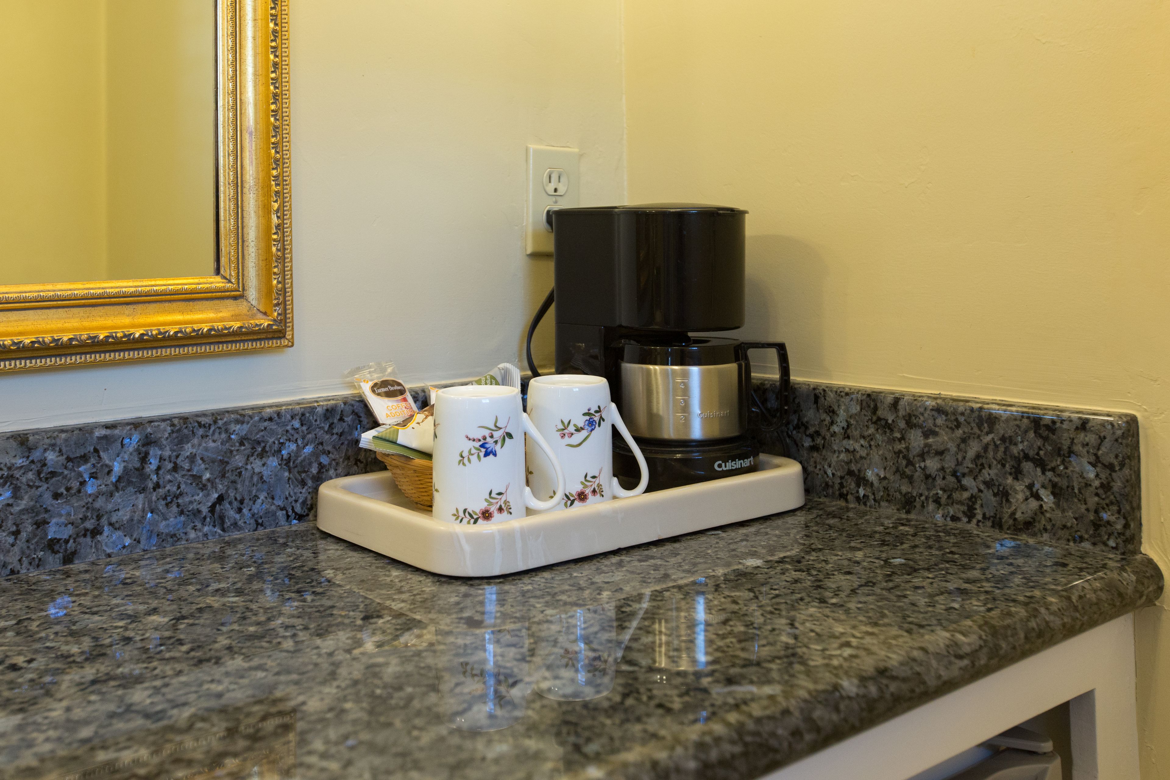 premium room, 1 king bed, fireplace | coffee and/or coffee maker