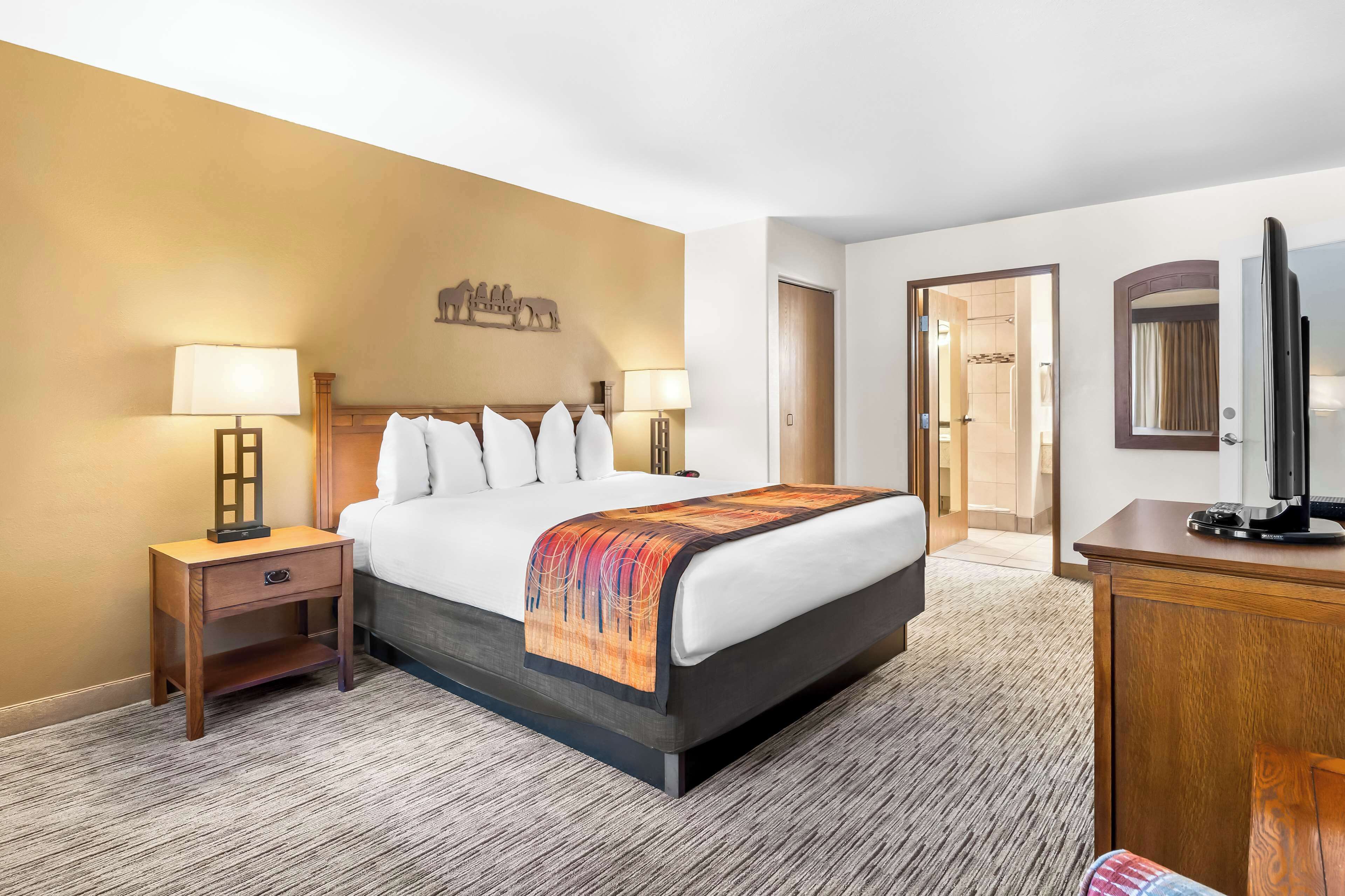 suite, 1 king bed, non smoking, jetted tub (with sofabed) | blackout curtains, iron/ironing board, free cots/infant beds