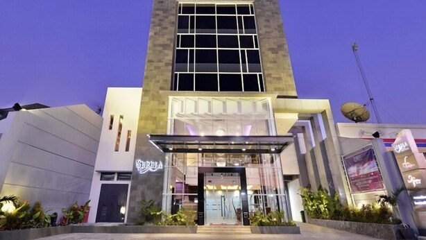 A modern hotel with a prominent entrance, a glass facade, and a sign for 'Sereia'. - Serela Waringin (Bandung)