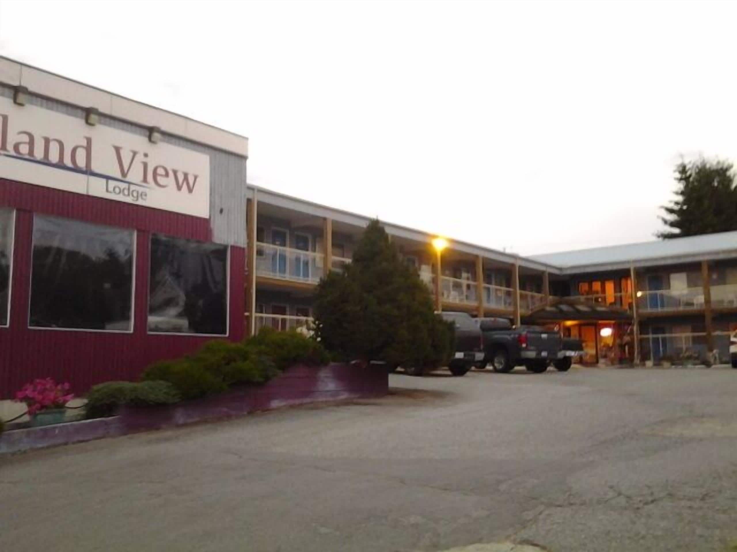 A building with a sign reading "Land View Lodge".