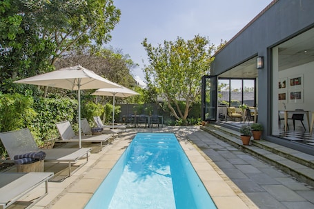 Outdoor pool, pool umbrellas, sun loungers
