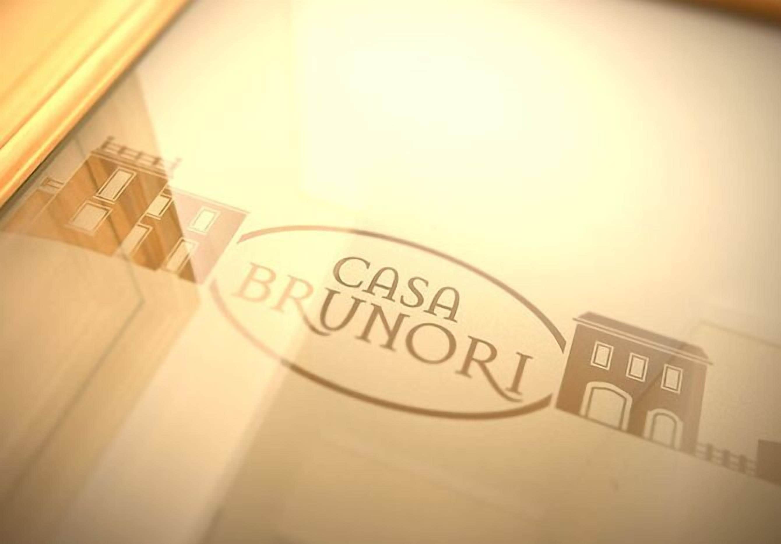 A logo with the text "CASA BRUNORI" and a simple building illustration.