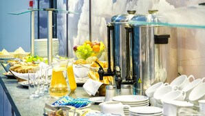 A breakfast buffet with various food items and a coffee station. - Automobil Hotel (Kraków)