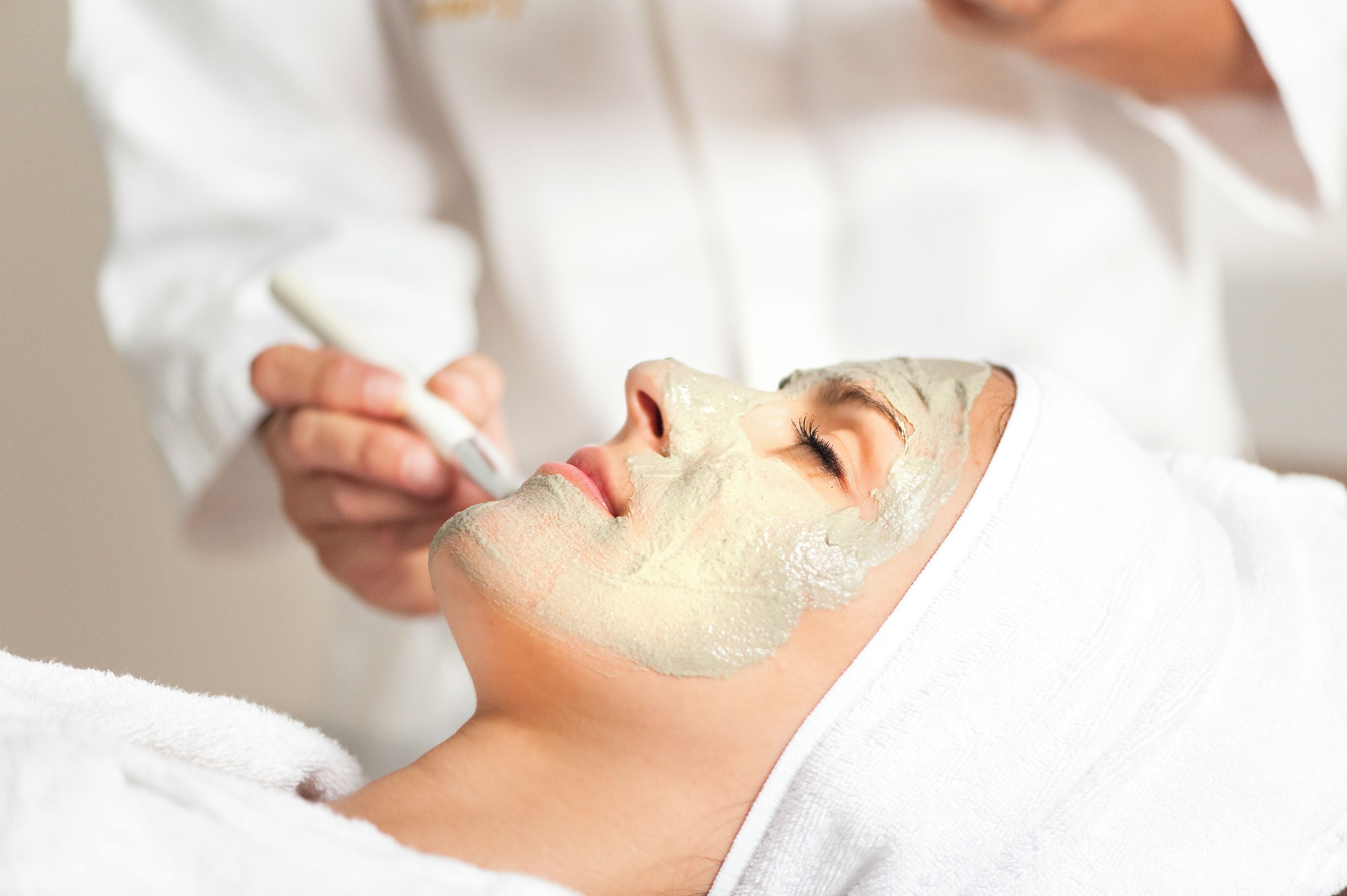 A person receiving a facial treatment.