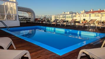 Outdoor pool, open 9:00 AM to 7:00 PM, pool loungers