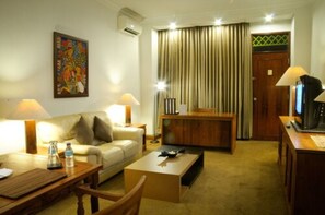 Premium Suite, 1 King Bed | Living area | 32-inch flat-screen TV with cable channels, TV - Mesra Business & Resort Hotel (Samarinda)