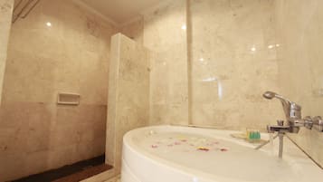 Premium Suite, 1 King Bed | Bathroom | Combined shower/bathtub, free toiletries, hair dryer, slippers
