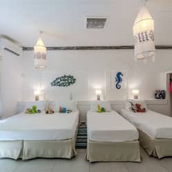 Beach House | Premium bedding, minibar, in-room safe, individually decorated