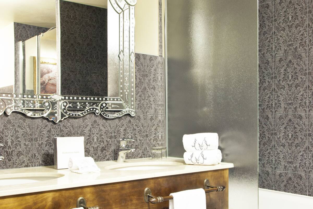 separate bathtub and shower, designer toiletries, hair dryer, bathrobes