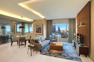 Executive Apartment, 2 Bedrooms | Living area | 32-inch LED TV with cable channels, TV, DVD player